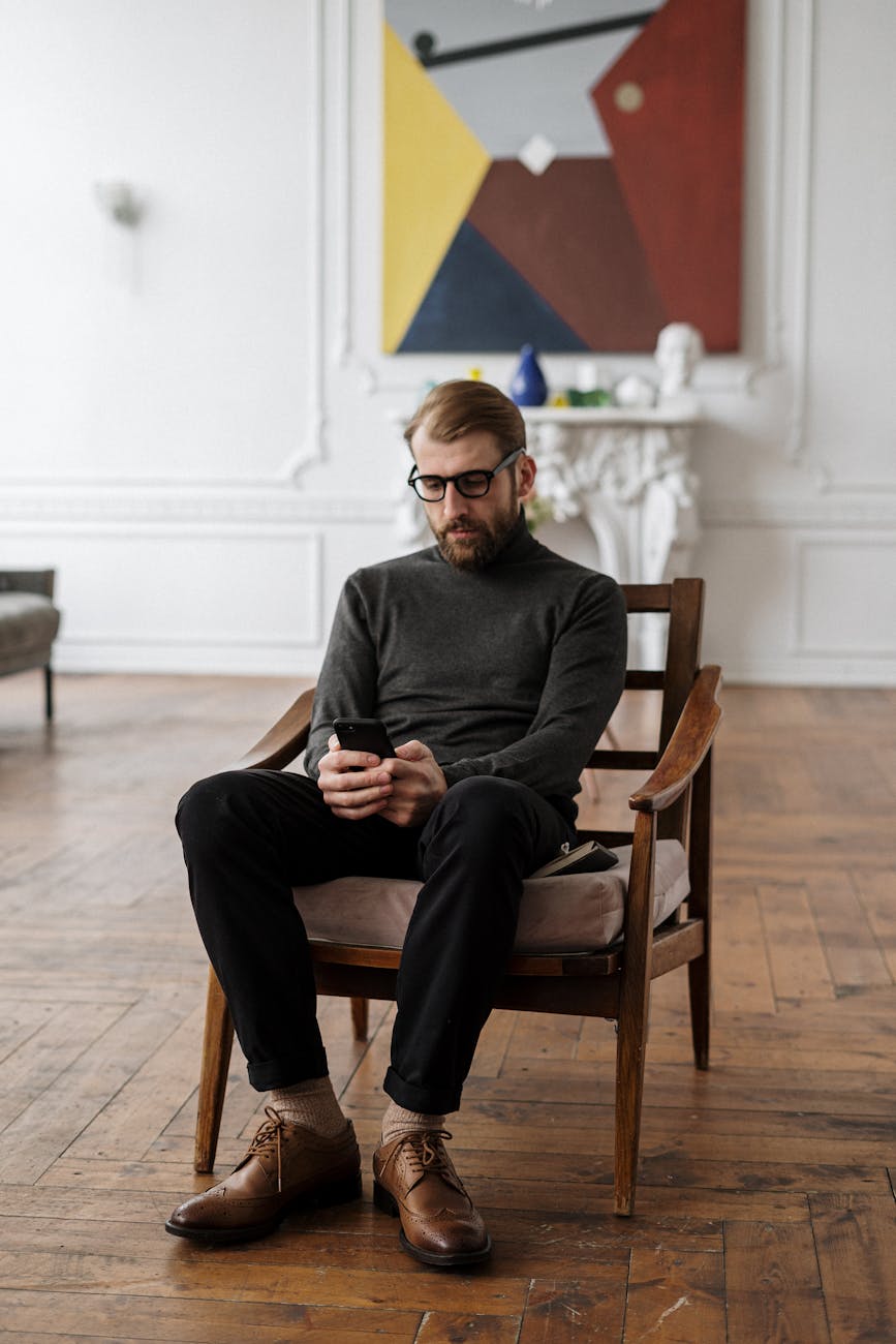 Man in a focused stance, illustrating balance and mental clarity in a minimalist setting.